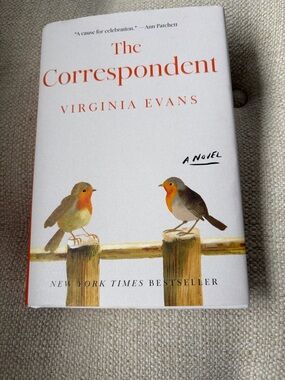 The Correspondent by Virginia Evans — White Cover with Orange Accents